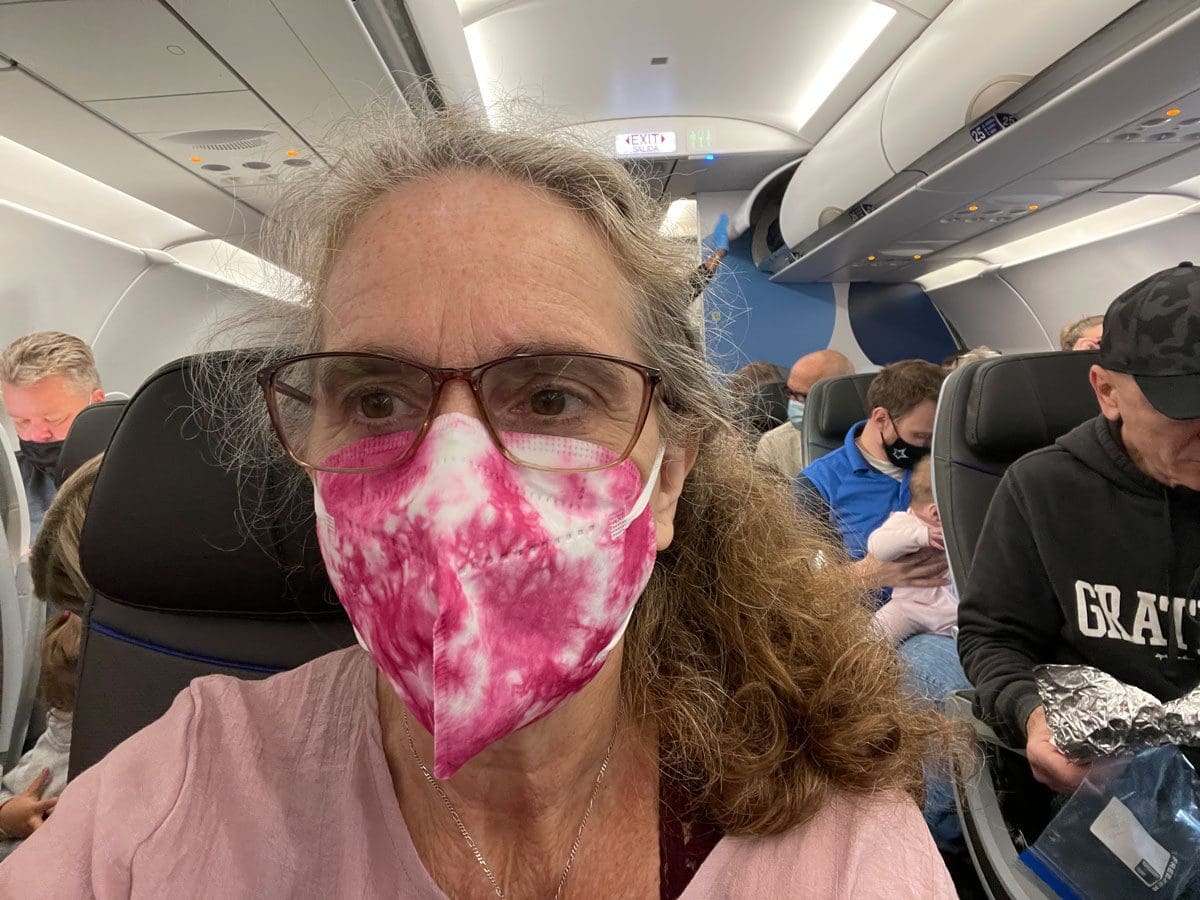 Christiana Masked on an Airplane